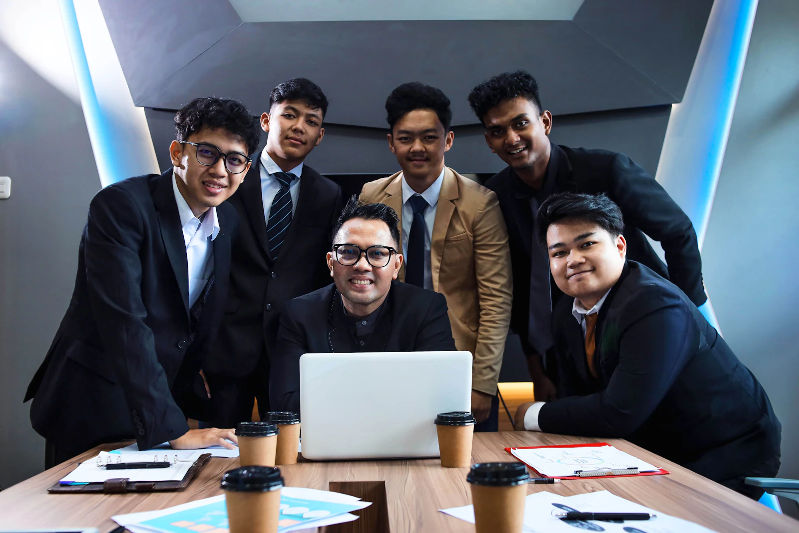 A team of professionals gathered around a meeting table