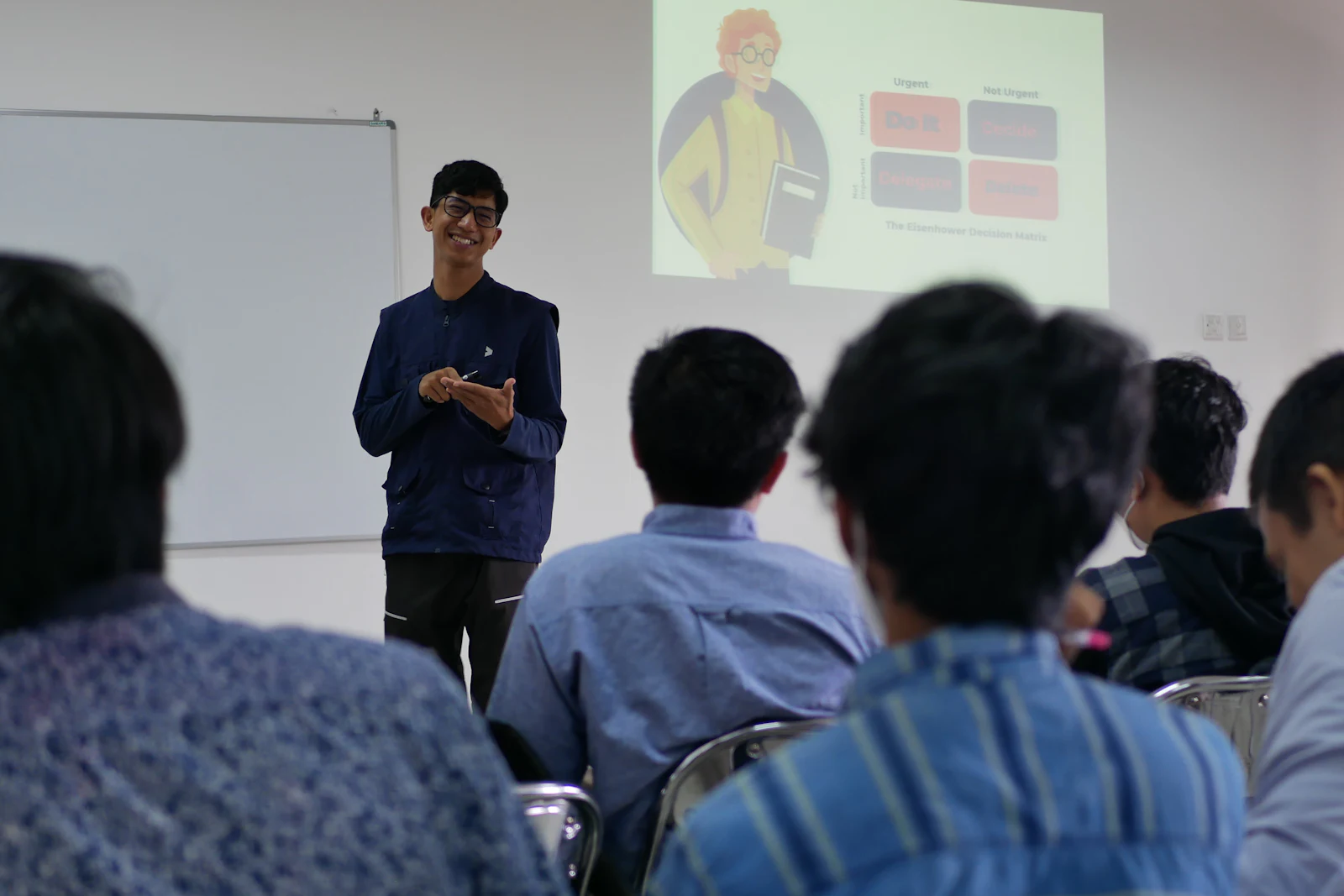 A facilitator leading a training session for a group